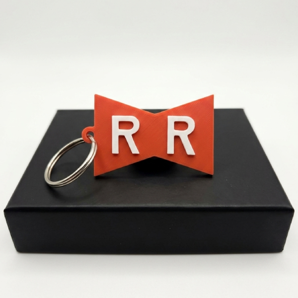 Porte-clés Ruban Rouge (RR) – Armée Red Ribbon